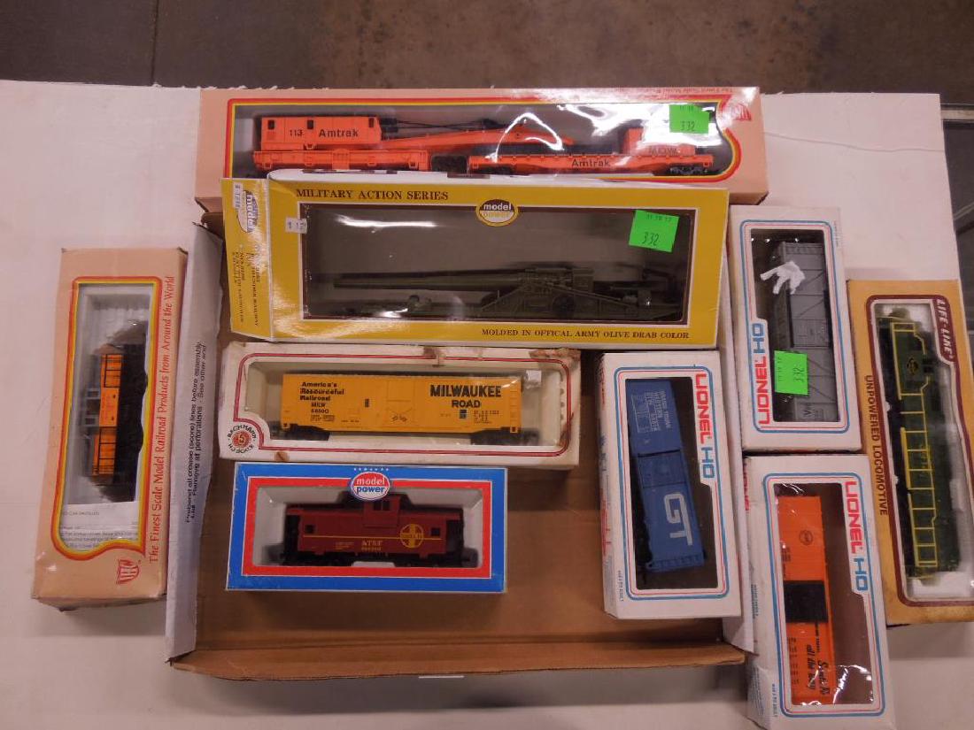 Assorted Lionel & Other Train Cars: Assorted Lionel & Other Train Cars, H O, some in original boxes, including three Lionel train cars, three box cars, Power Model Santa Fe red caboose, Life-Like Reading Line dummy engine, Amtrak crane 