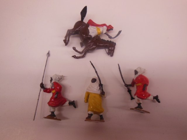 4 Vintage Metal Arab toy figures w/ moveable arm: Britains including horse with rider, 3 1/2", (horse marked underneath), 2 figures with guns, 1 with spear, 2 1/4", hand painted Condition; some minor wear and minor paint loss from age and use