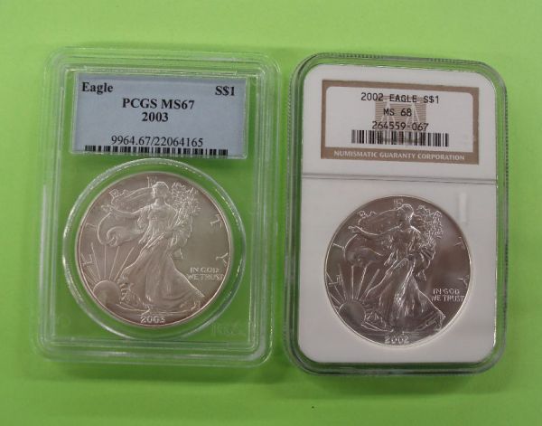 Two U.S. Silver eagle dollars: Two U.S. silver eagle dollars 2002 MS-68, 2003 MS-67