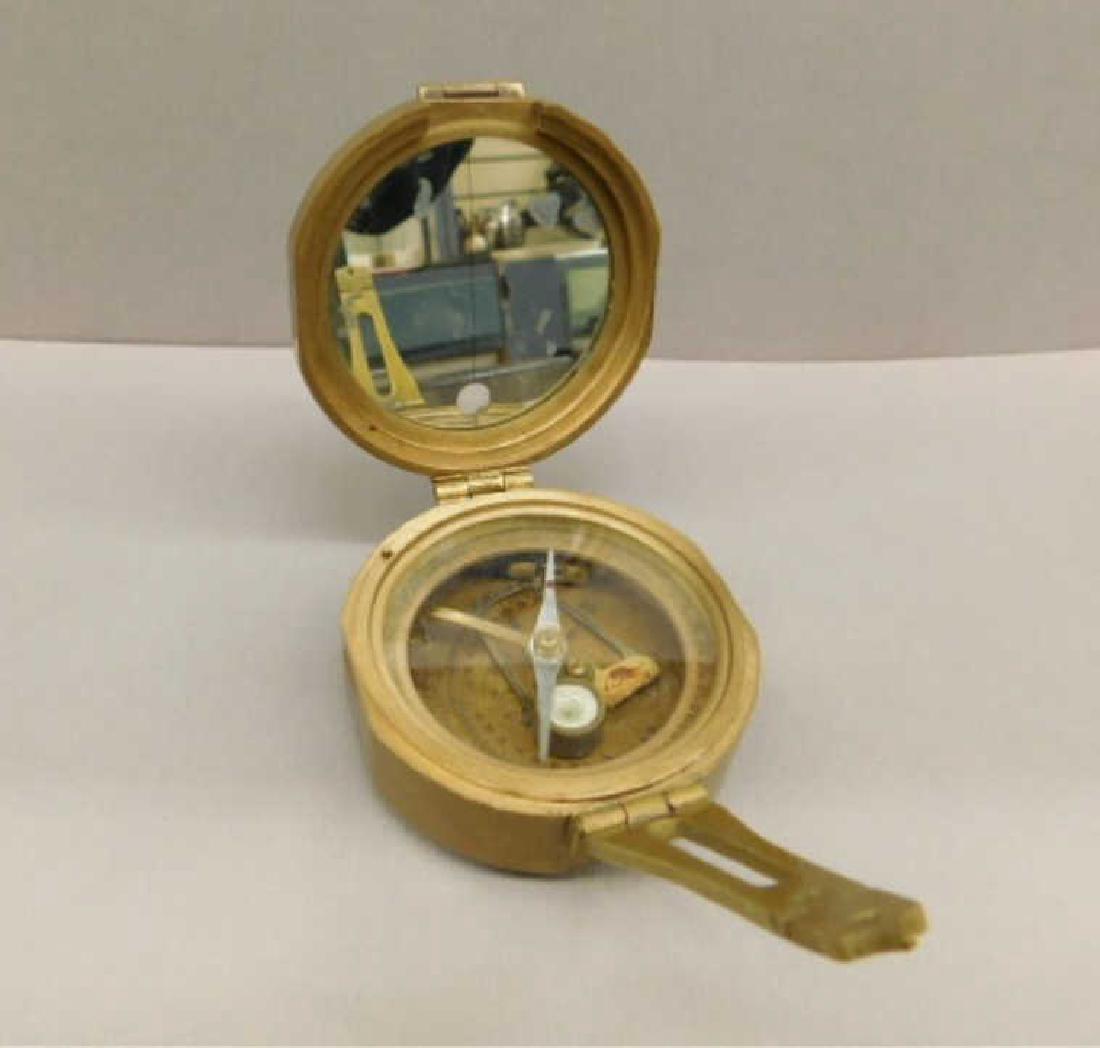 Brinton Compass: Brinton Compass brass, hinged lid engraved C.S.A. Thos. J. Evans, Esq. London MK1 1862, mirrored & glass interior with two levels possibly a 20th c. replica, diameter 3 1/4', H 1 5/8". CONDITION: Tarn