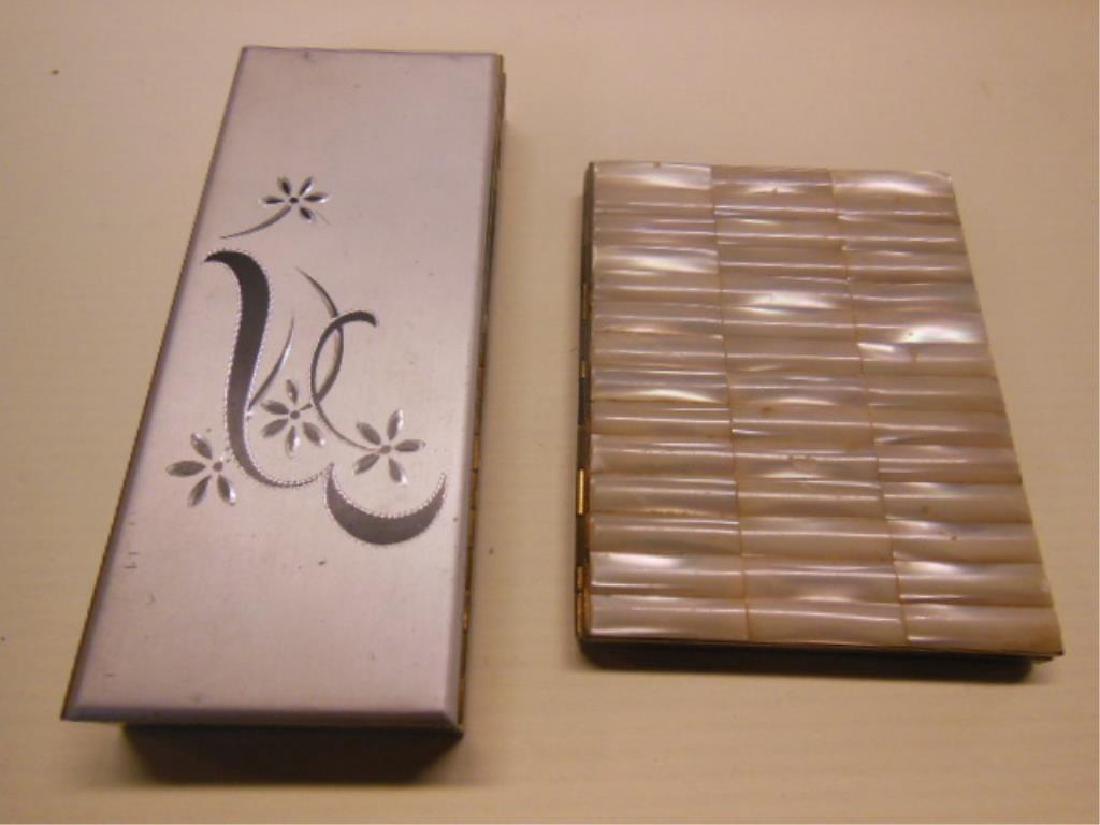 2 Vintage Cigarette cases: 2 Vintage Cigarette cases (1) with lighter, floral etched, flip lid top with pop up lighter, 2 1/4" x 5 1/4" and (1) with mother of pearl front over brass, 3 1/8" x 3 7/8" untested, no fluid Condition