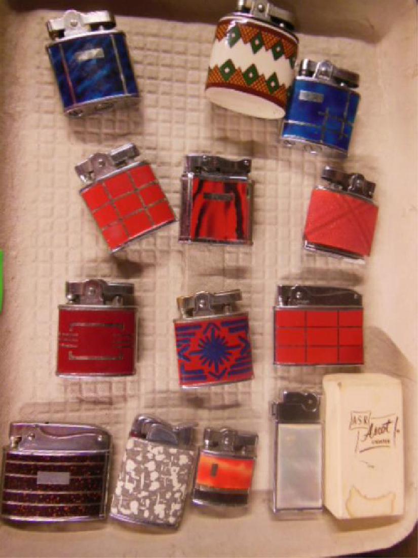 13 Vintage Decorative Lighters: 13 Vintage Decorative Lighters some with enamel, mother of pearl and silvertone inlay, Zenith, Evans, A.S.R., Ascot, Omega, Firelite and others, all wheel and flint, untested, no fluid Condition; mino