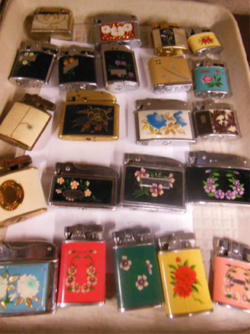 22 Vintage Floral Decorated Lighters: 22 Vintage Floral Decorated Lighters some etched, painted, applied, Continental, Buxton, Supreme, Ronson, Colibri and others, 1 1/2" - 2 1/4", untested, no fluid Condition: leather and Colibri have su