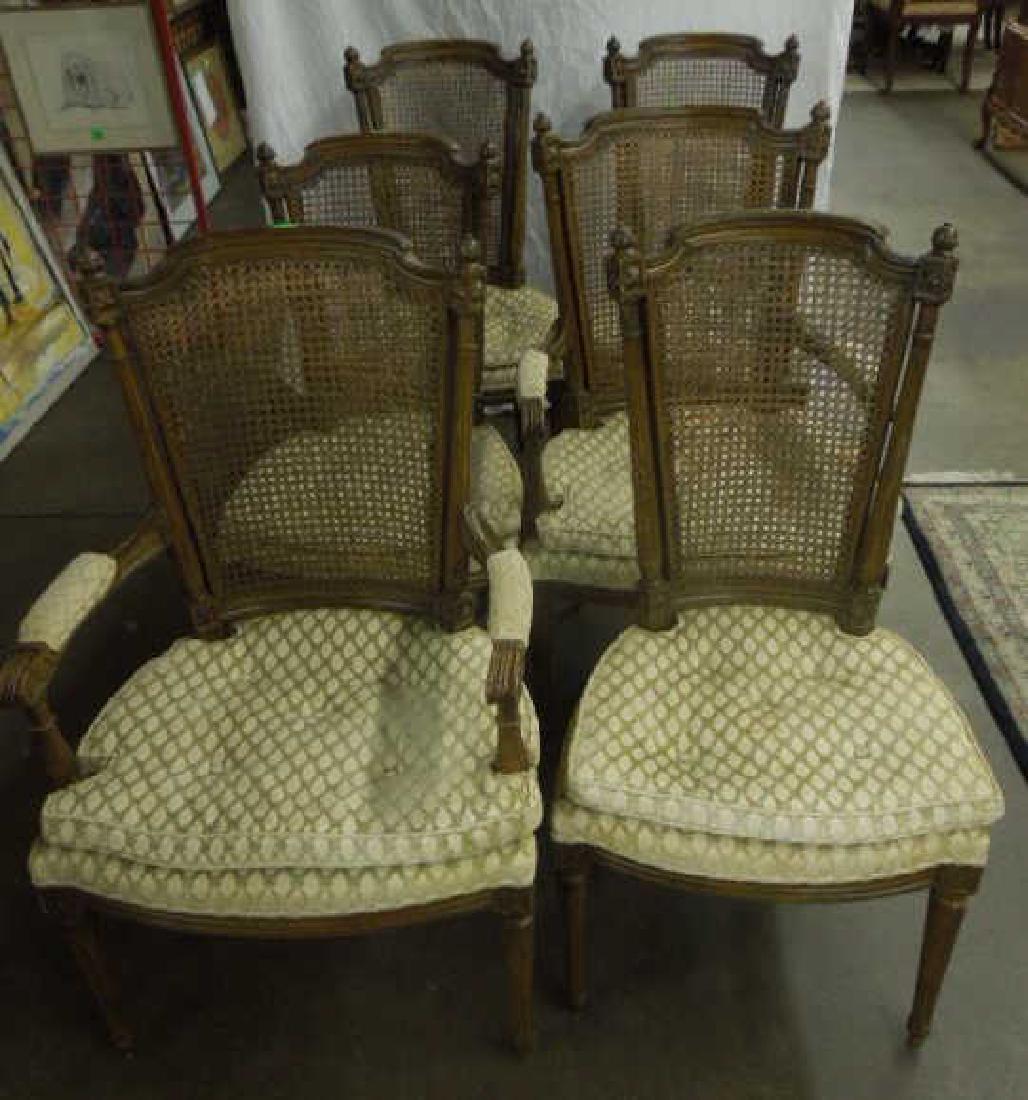 Set of 6 Louis XVI Style arm/side Chairs: Set of 6 Louis XVI Style arm/side Chairs, fruitwood and features caned backs, rosette, reeded and finial carvings, patterned pale yellow velour upholstery, 20th C. CONDITION: Areas of wear, finish los
