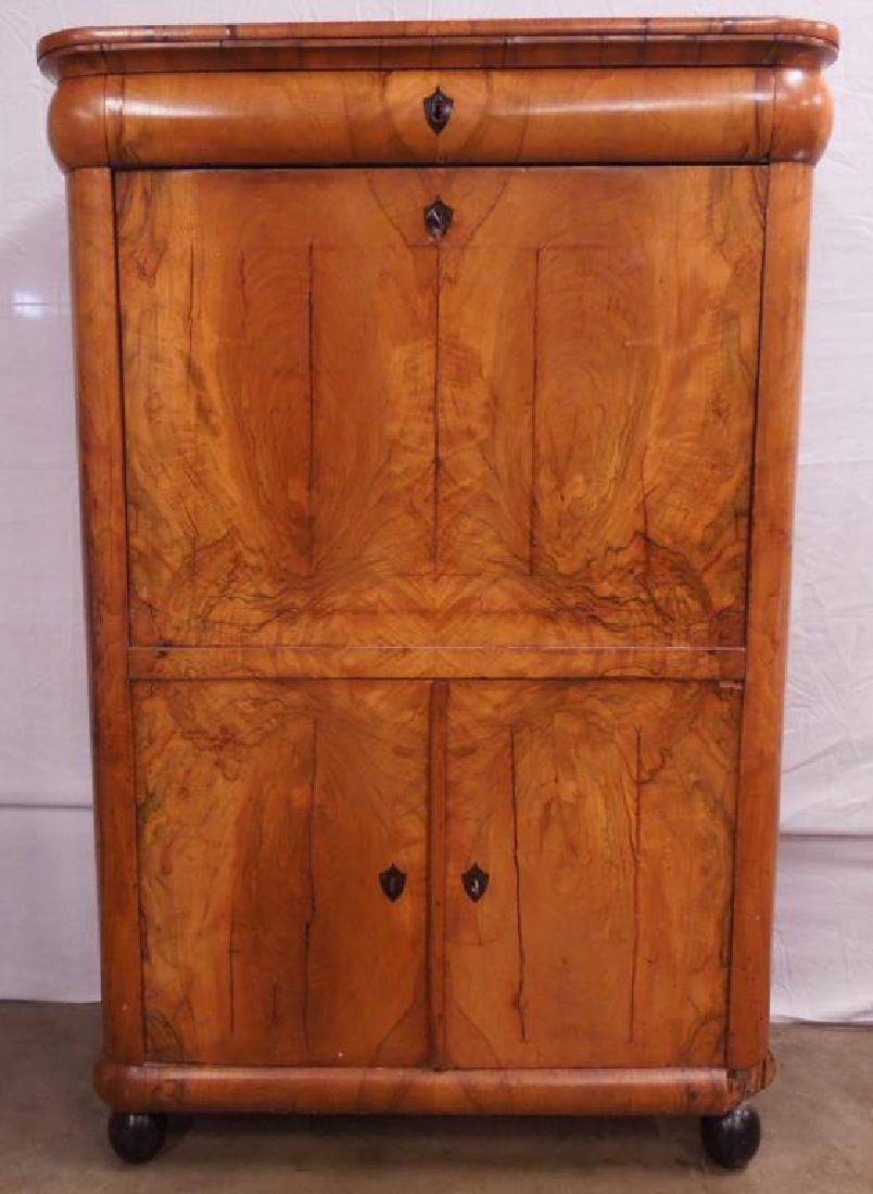 Biedermeier Secretaire Abbatant: Biedermeier Secretaire Abbatant , flame grained walnut, features, single convex drawer over a drop front with fitted interior of ten drawers, again over two doors, all with ebonized shield form escutc