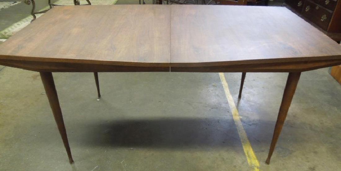 Scandinavian Modern Dining Room Table: Scandinavian Modern Dining Room Table, walnut, swelled profile table surface, extension top with two 15" leaves, turned tapered legs, [purchased from Scandia, Walnut St, Phila, c 1960s,] 38" x 64" x 2
