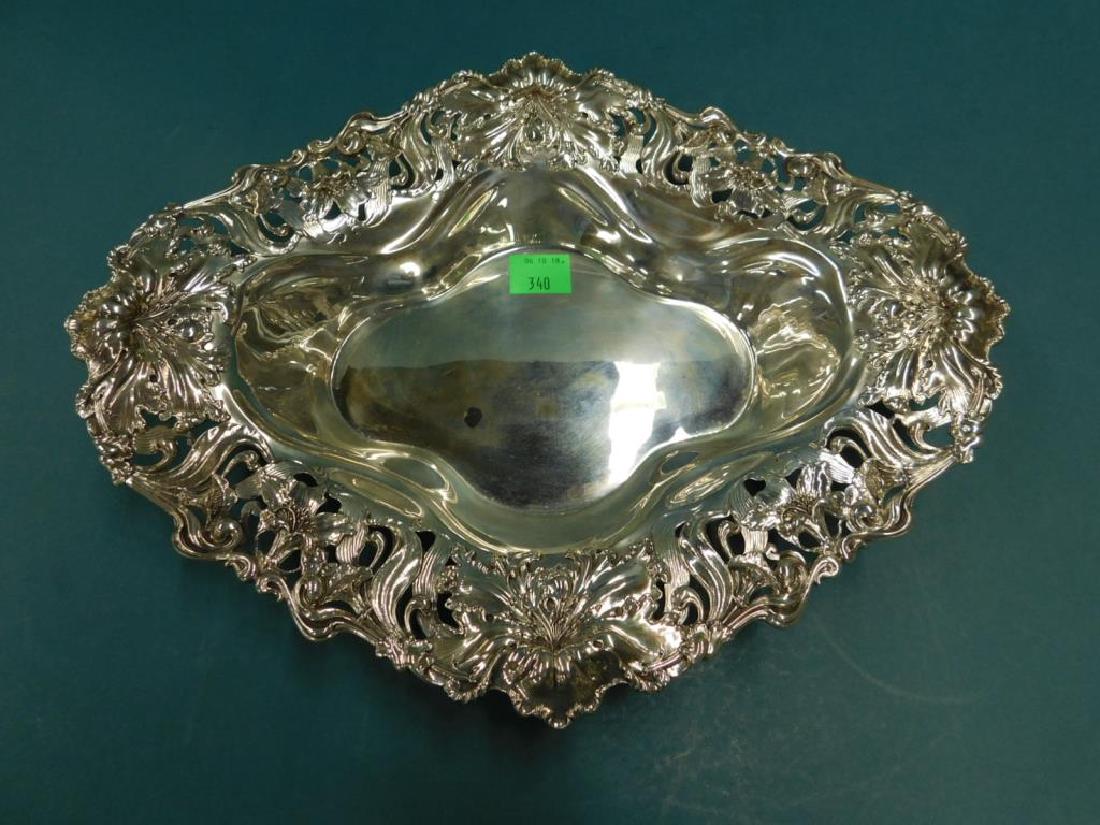 Large Art Nouveau Sterling Centerpiece Bowl: A very Large Art Nouveau Sterling Centerpiece Bowl by George W Shiebler, New York 16"l, 12 1/4' w, exuberantly decorated with orchids which are pierced, raised applied and chased on the rim of the bow