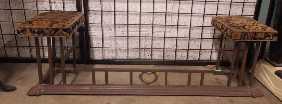 Arts & Crafts Style Fireplace Fender/Bench: Arts & Crafts style fireplace fender/bench, square tubular brass with raised cushioned end seats, early 20th c. 54" x 16" x 16". CONDITION: Tarnished, rusted panel under one seat.