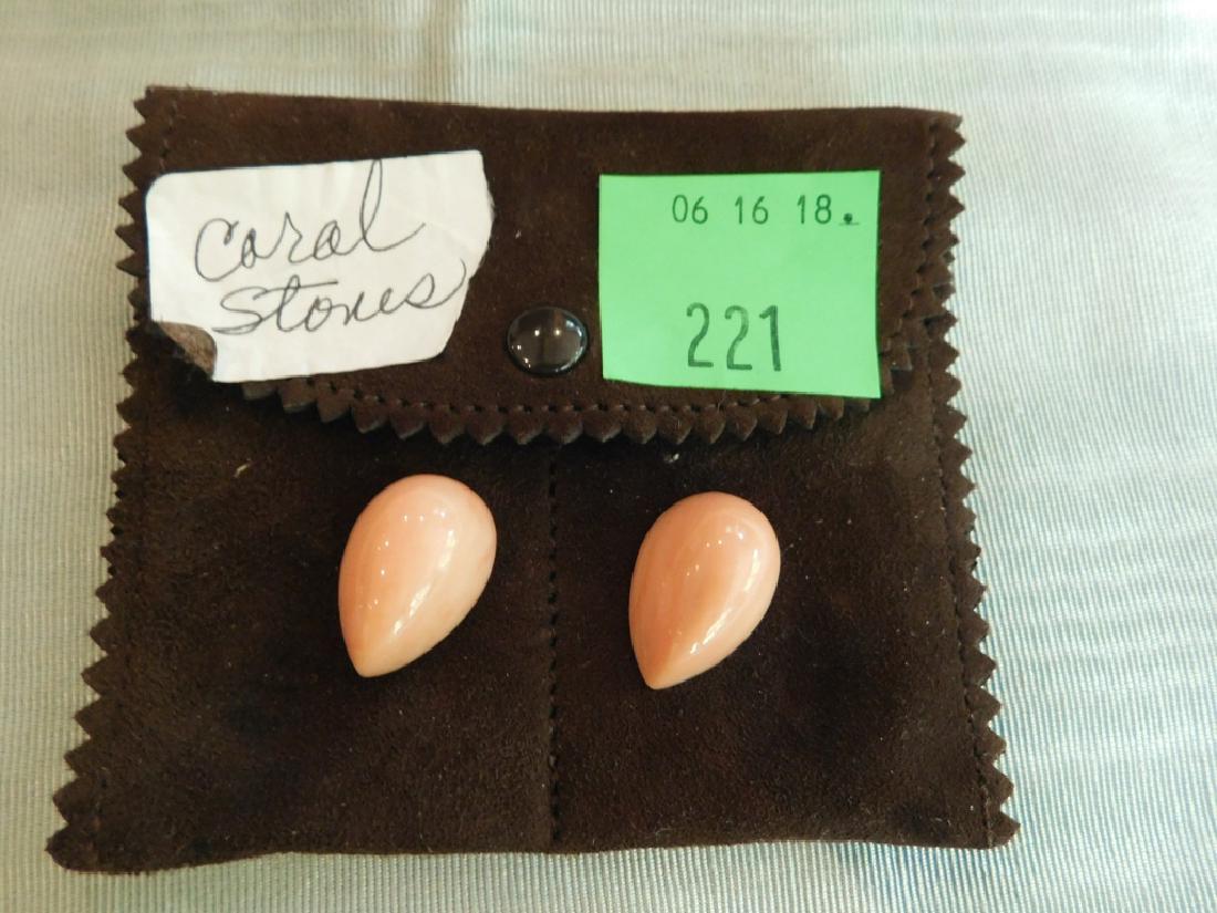 Two Loose Pink Coral Stones: Two Loose Pink Coral Stones. Drilled, with metal threading inserted. Contained in a suede van Cleef & Arpels pouch labeled "Extra (coral) 2 stones". Each 7/8" long.