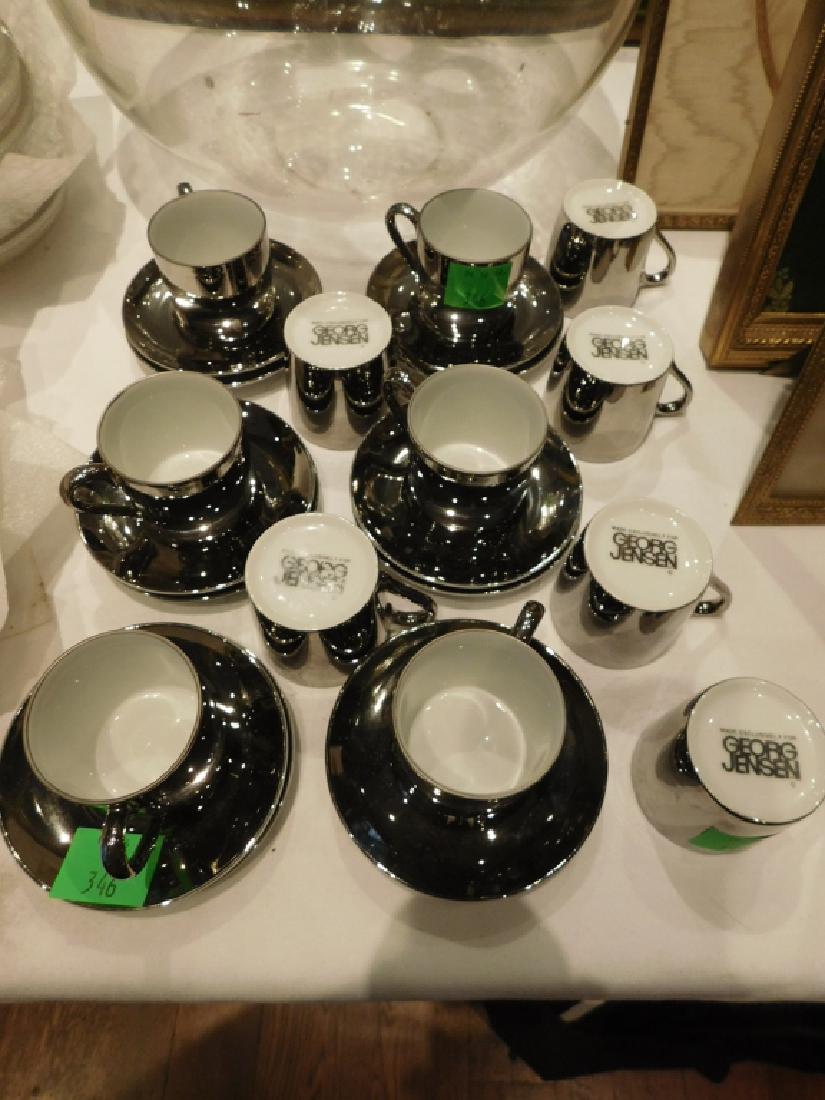 Set of Twleve George Jensen Demitasse Cups: Set of Twelve George Jensen Demitasse Cups. Late 20th c. Porcelain, made for Georg Jensen, in white body with platinum lustre glaze. Cup 2" h.