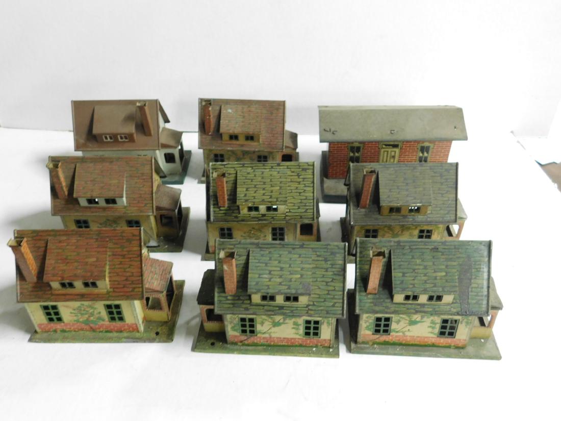 8 Vintage Lionel Tin Litho Buildings: 8 Vintage Lionel Tin Litho Buildings, Prewar including: seven houses, four 184-1, two 184A-1 and one , 2 3/4" x 4 3/4" x 4 1/2"h each, plus one brick station?, 4" x 6 1/8" (at base), 3 1/2"h. CONDITIO