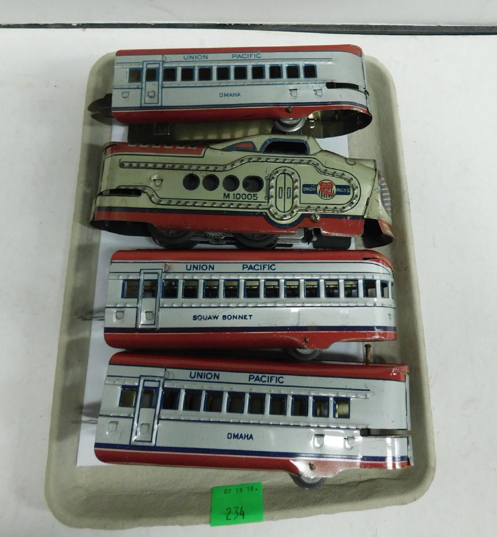 Marx Prewar 4 Piece Tin Train Set: Marx Prewar 4 Piece Tin Train Set, Union Pacific, M 10005, O gauge tin train set, red and silver with Diesel engine, plus three tin litho train cars including: two Omaha and one Squaw Bonnet, untested