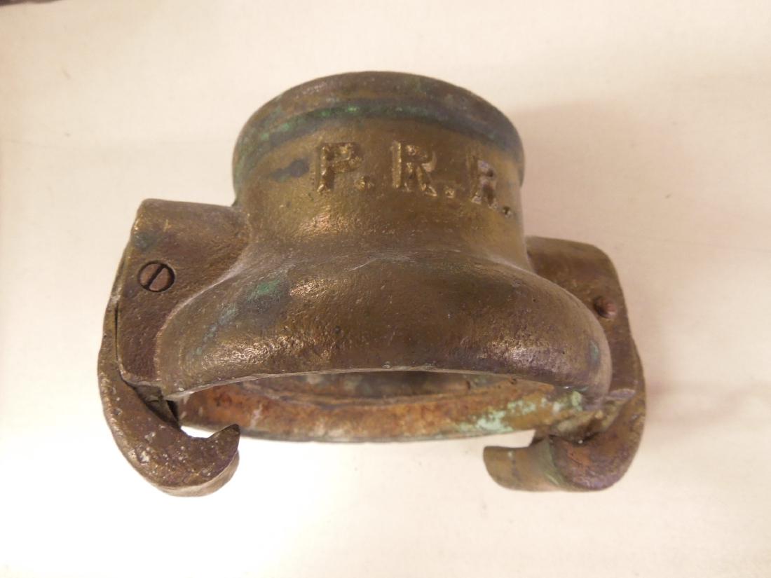 Vintage P.R.R. Brass Hose Coupling: Vintage Pennsylvania Railroad brass hose coupling, 2 3/4" inner opening, 3 5/8" outer opening with two hinged side clips (screw mounted). CONDITION: Some outer wear and oxidation, inner wear from age 