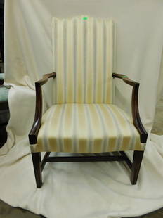 Hepplewhite Style Lolling Chair: Hepplewhite Style Lolling Chair, mahogany, stripped yellow upholstered serpentine crested back and seat, shaped open arms, tapered square legs with stretchers, late 20th, 43"h. CONDITION: Very good, s