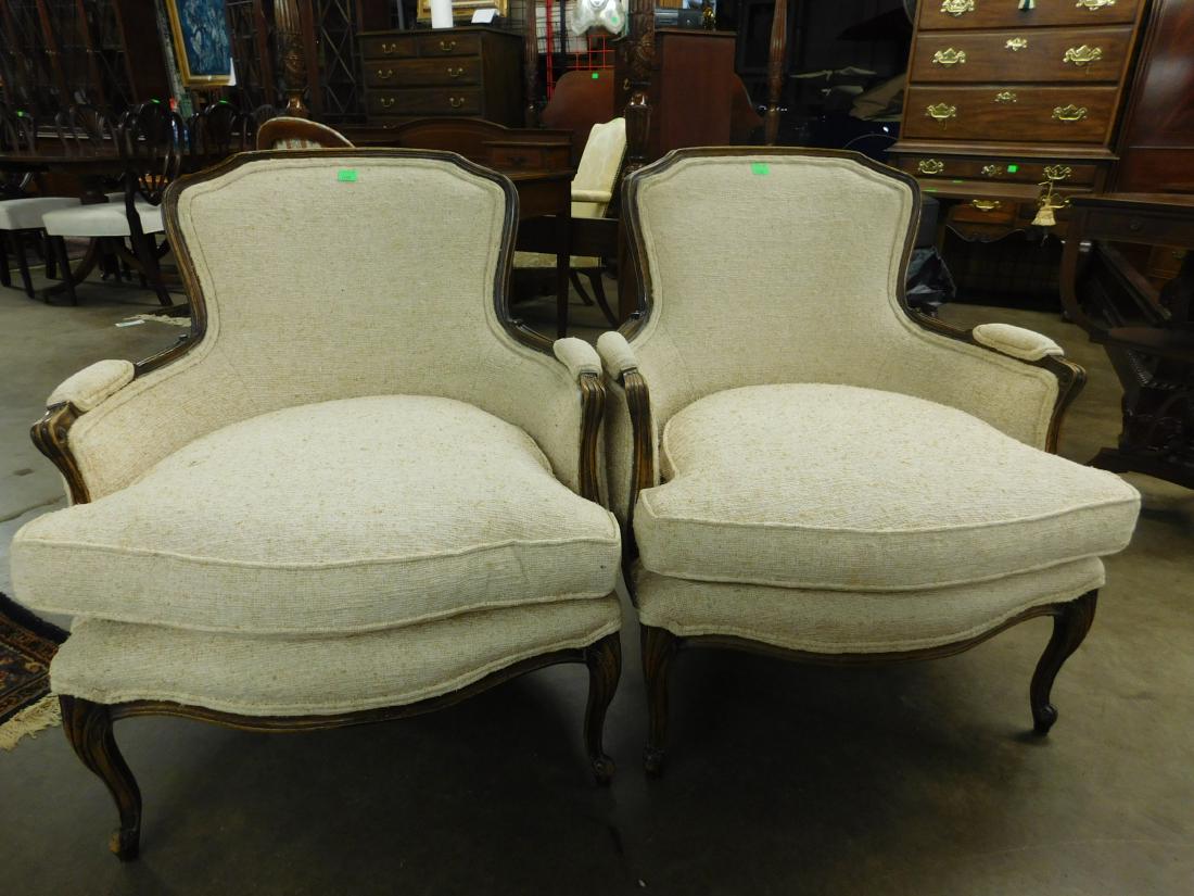 Pr Louis XV Style Bergere: Pr Louis XV Style Bergere, Fruitwood, cloth upholstery, cabriole legs with scroll feet, 20th C, 34"h. CONDITION: Good, finish wear on frame.