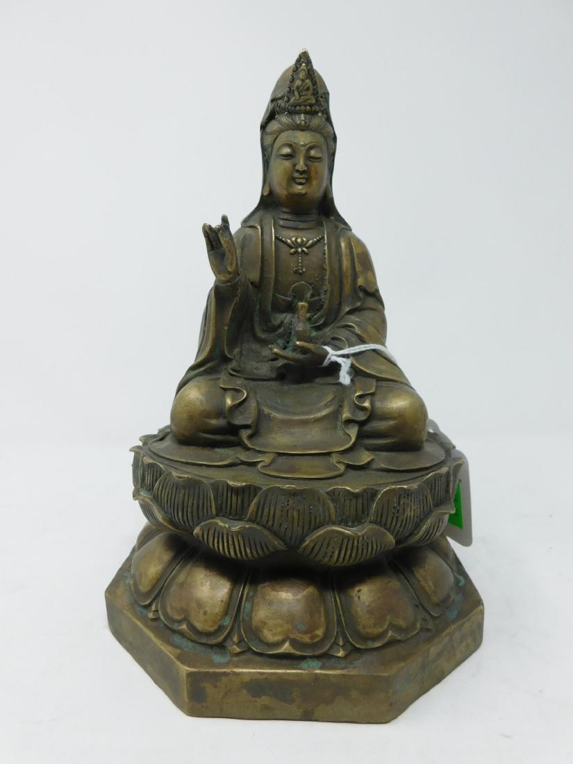 Chinese Brass Quan Yin: Chinese Brass Quan Yin, seated figure on a Lotus form base, embossed chop mark on base, 20th C, 8"h. [6] CONDITION: Very good, no issues identified.