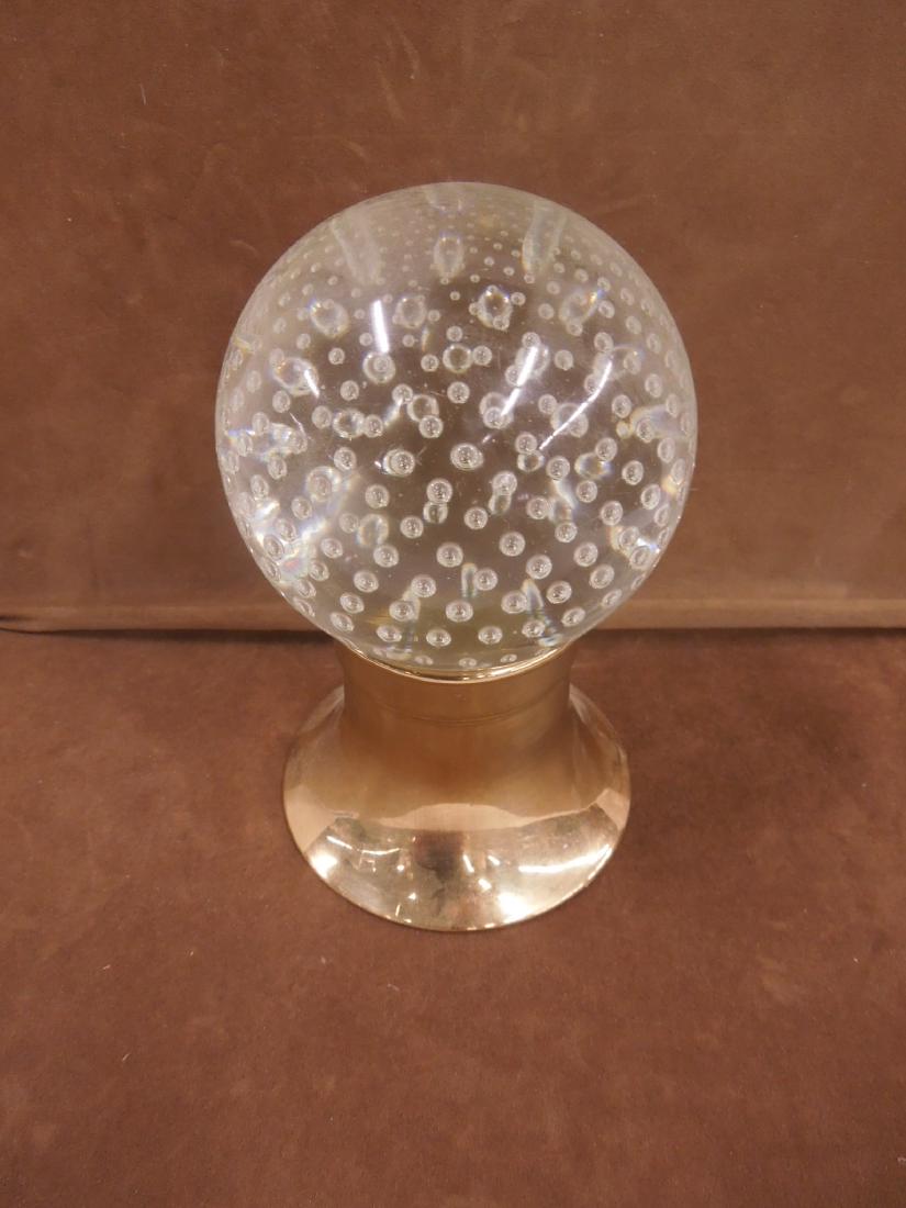 Antique Controlled Bubble Newel Post Ornament: Antique Controlled Bubble Newel Post Ornament, probably French and 19th c., possibly Baccarat. Spherical form with extended neck for mounting in a metal fitting. Sitting on a contemporary brass base.