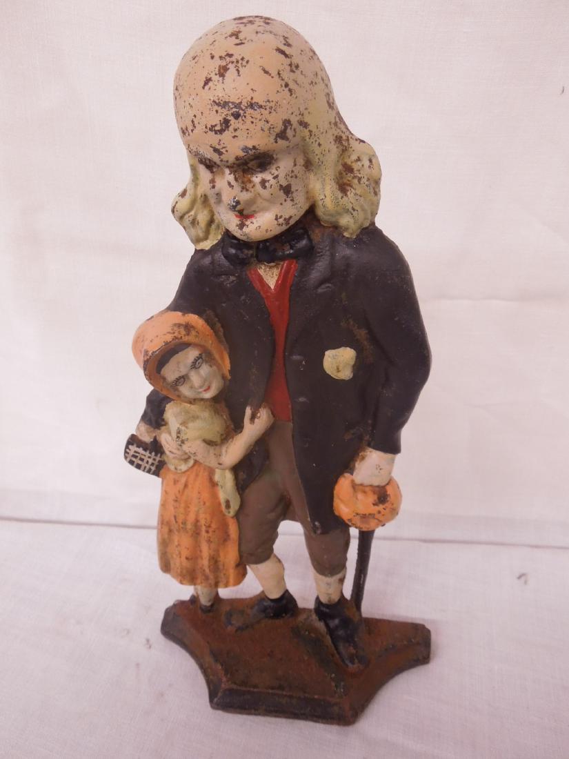 Vintage Cast Iron Ben Franklin Doorstop: Vintage Cast Iron Ben Franklin Doorstop, with girl, hand painted, 14 1/2" h. Condition; surface rust at base, spots of paint loss throughout