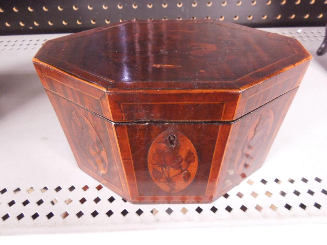 Neoclassical Inlaid Tea Caddy: Neo Classical inlaid tea caddy, banded mahogany, oblong form with oval floral inlaid panels, key lock lift lid with remnants of foil liner, early 19th C, 7" x 5" x 3 3/4" CONDITION: very good minor we
