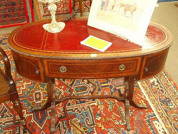 Lady's Desk, Duncan Phyfe style: Lady's desk, Duncan Phyfe style, mah, oval form w/red tooled leather top over a wide freize with a long drawer flanked by paneled doors, all w/band & oval paneled line inlays. The double lyre-form bas