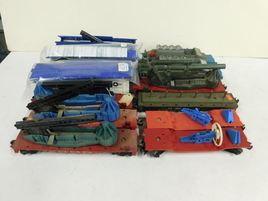 12 Lionel Space and Military Train Cars: 12 Lionel Space and Military Train Cars, O gauge, post war (all missing their missles), including; (2) Turbo Missle launching cars, No. 3349 (with one turbo missile), (3) Minuteman cars, No. 3665 (2 w