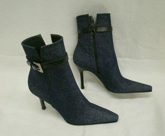 Stuart Weitzman navy denim boots, 7m: Stuart Weitzman navy denim boots, 7 m, ankle length, trimmed w/black leather & w/3 1/2" black leather heels, pointed toes. Size 7M "Neiman Marcus", price $245