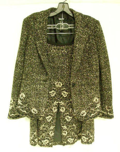 DKNY black/white tweed suit: DKNY black/white tweed suit, size 10 fitted, long-sleeved jacket with black/white lace applique at the cuffs and around the hem, lined with black polyester, labeled "DKNY, Donna Karen, New York," sing