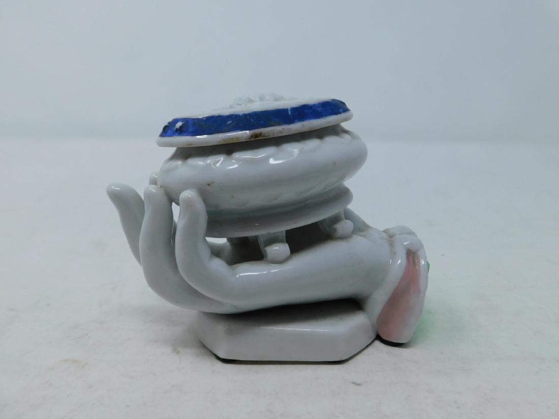 Vieux Paris Porcelain Hand Box: Vieux Paris Porcelain Hand Box : Old Paris porcelain box in the form of a hand holding a small footed oval casket with an American eagle on the lid. Provenance: Robert A Goldstein. Size: 4.75" wide. C