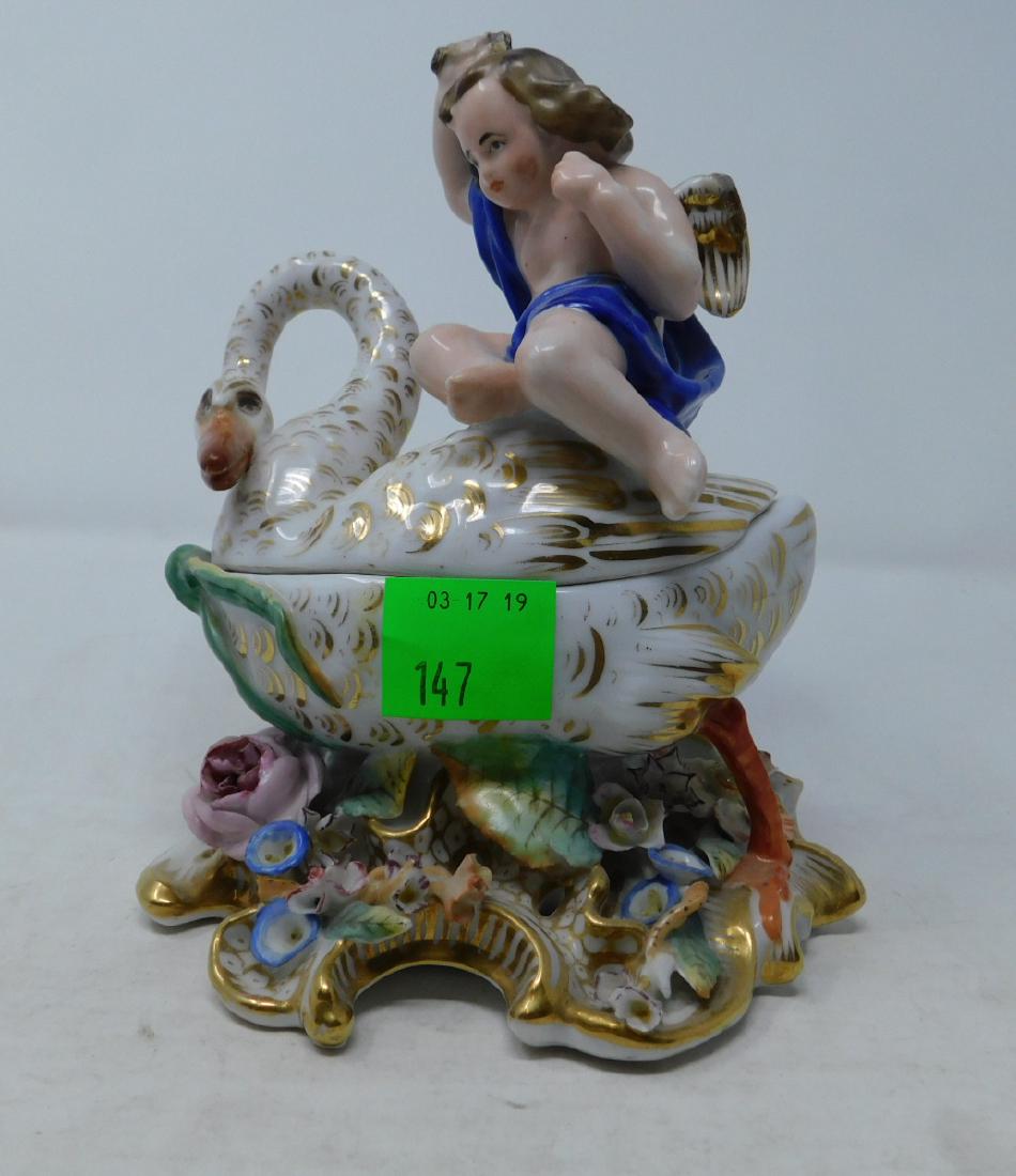 Vieux Paris Porcelain Figural Inkwell: Vieux Paris Porcelain Figural Inkwell: Old Paris porcelain figural inkwell of an unusual form of a putto with a sword on a swan's back, standing on an elaborate Rococo base with applied porcelain flow