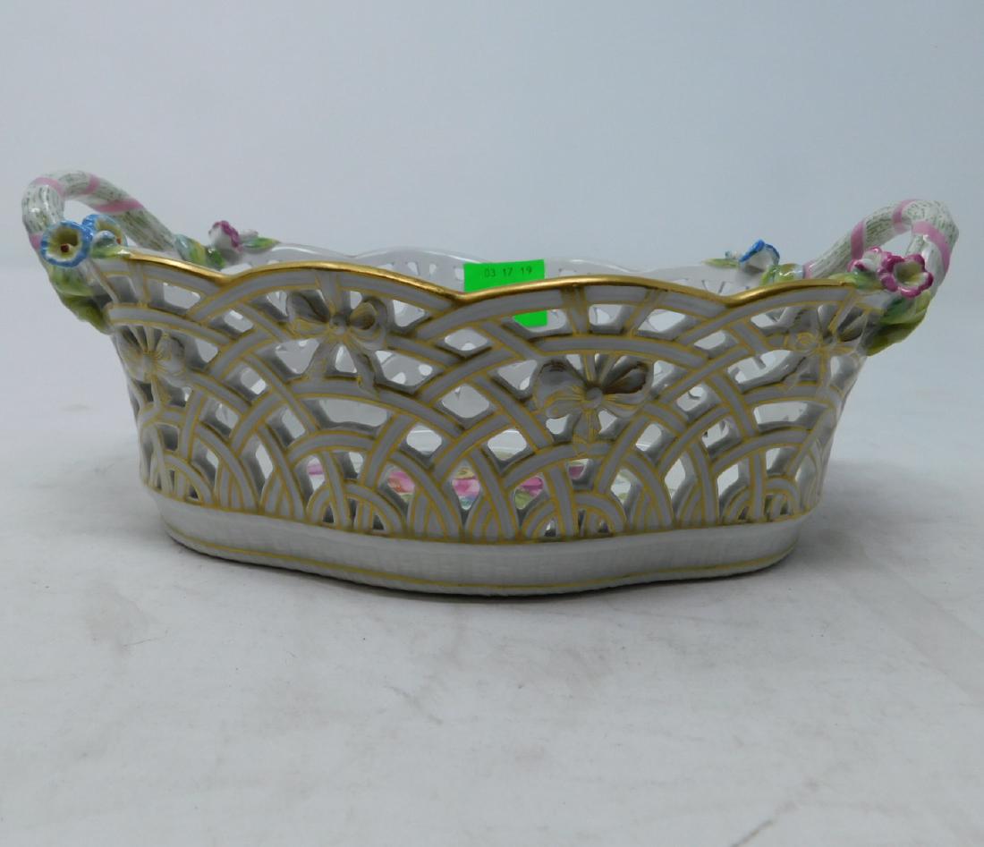 Antique KPM Porcelain Reticulated Basket: Antique KPM Porcelain Reticulated Basket: An antique oval-form, reticulated, handled centerpiece basket by the Kanigliche Porzellan-Manufaktur Berlin, decorated with applied flowers, and a large, hand