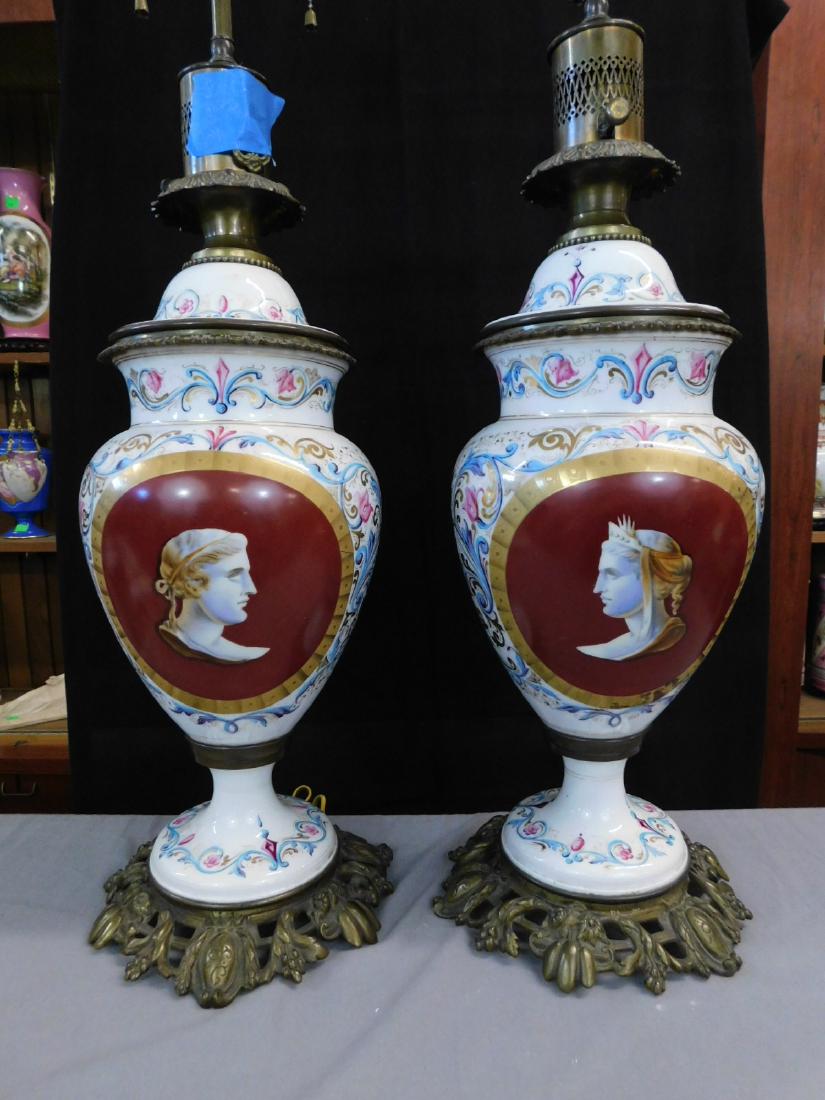 Pair Massive Vieux Paris Porcelain Fluid Lamps: Pair Massive Vieux Paris Porcelain Fluid Lamps: Consisting of Old Paris porcelain parts mounted in gilt bronze. Urn form, decorated with Renaissance Revival style elements in blue rose and gold around