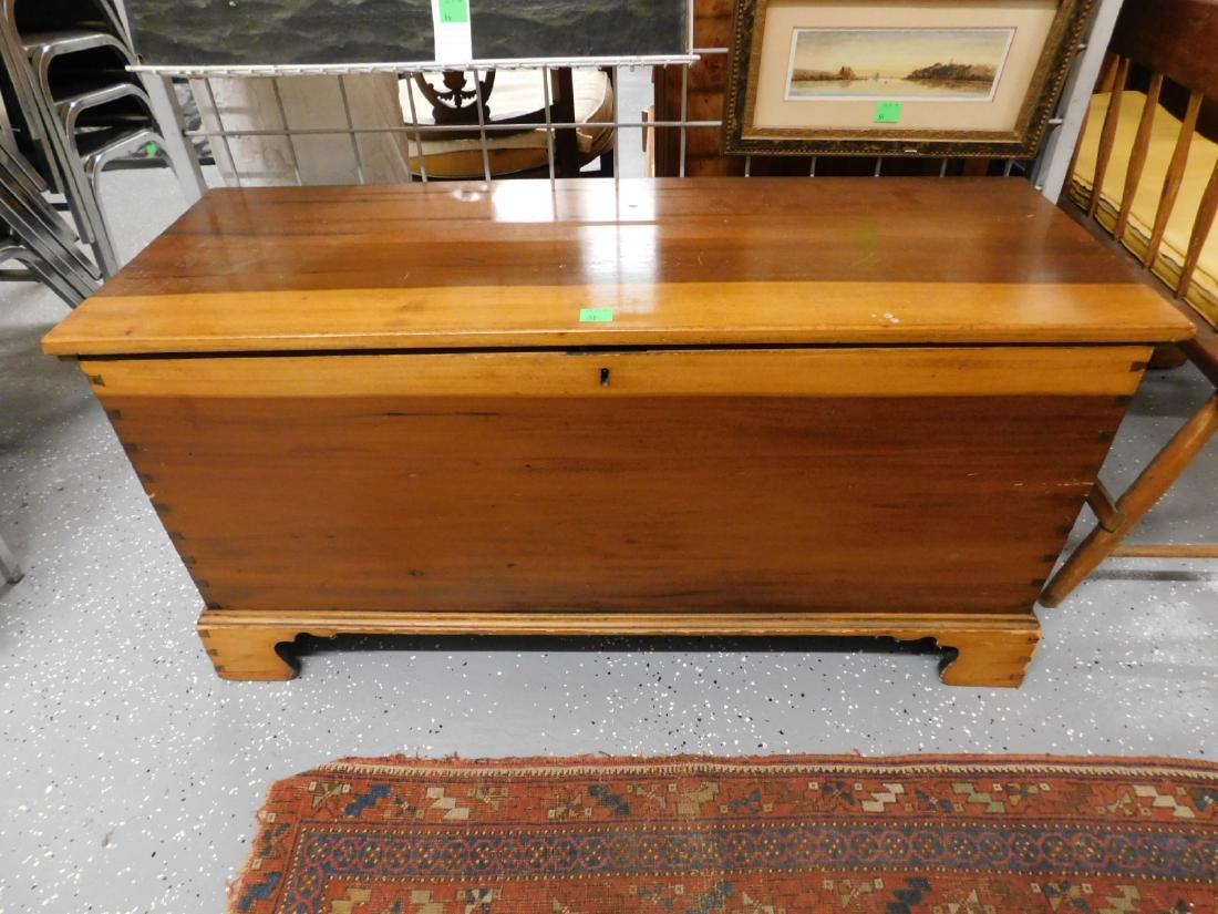 American Blanket Chest: American Blanket Chest, six board, cherry two tone wood, lift lid with twin interior tills; key lock, dove tailed ends and bracket feet, 19th C; 44" x 16 1/2" x 22". CONDITION: Older refinished condit