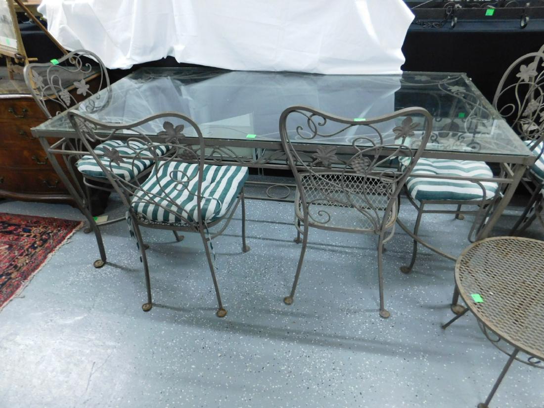 8 Pc Patio / Dinette Set: Eight Piece Patio / Dinette Set, wrought iron, gray painted with grape cluster embellishments, metal mesh seats, includes: glass top, 36" x 72" x 30 1/2" table, four side and two arm chairs, 37"h, one