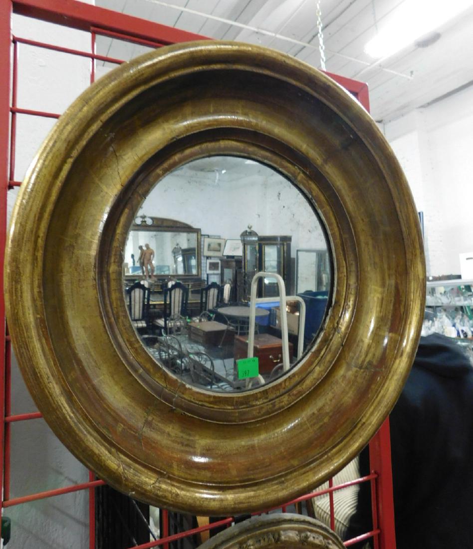 American Antique Round Mirror: American Antique Round Mirror,wide and deep ogee molded frame with distressed gilt finish, early 19th C, 22 1/4" d, 4"depth. CONDITION: Gilt wear, areas of thin open joints, cracks and repairs; spotti
