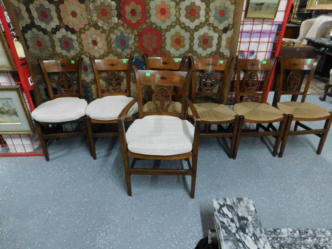 Set of 7 Biedermeier Chairs: Set of seven Biedermeier Chairs, walnut, scrolled styles with curved crest panel having ebony inlaid diamond pattern over a pierced floral urn, carved oval cartouche bowed rush seat, straight legs and