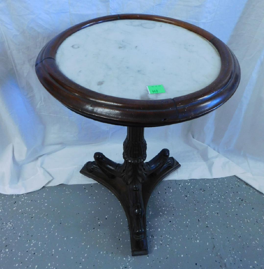 Transitional Classical / Victorian Stand: Transitional Classical / Victorian Stand, walnut, rotating framed round white marble top on a reeded and acanthus carved pedestal terminating to a unique bent knee, hoof foot tripod base on platform, 