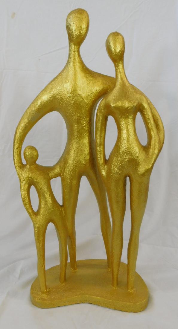 Gilt Modern Family Sculpture: Gilt Modern Family Sculpture in composition plaster by Austin Productions, depicts standing mother, father and child on kidney shaped base, late 20th C. Marked AUSTIN PROD 1979 on back of base. 12" x