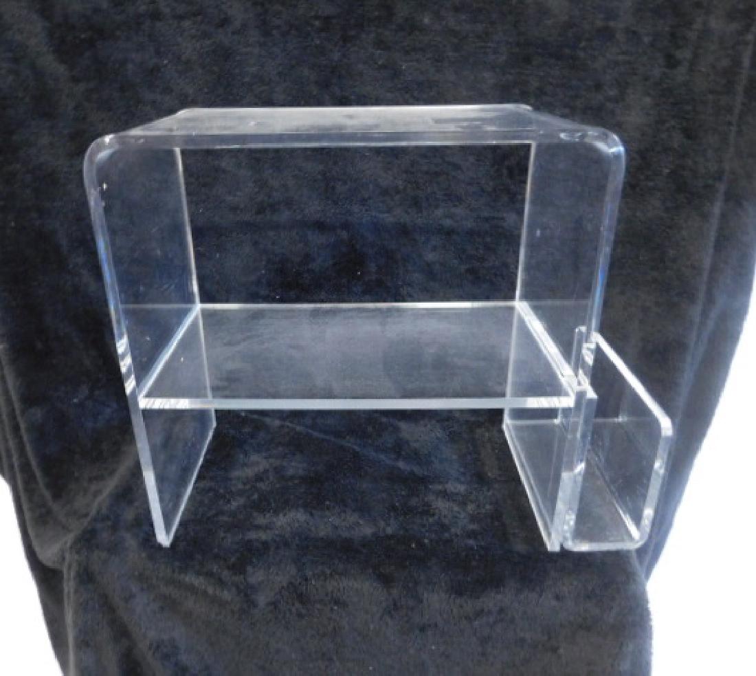 Lucite End Table / Magazine Rack: Lucite End Table / Magazine Rack, clear lucite construction with center shelf and one side having an attached magazine rack, late 20th C, 11" x 20 1/8" x 24 1/4". CONDITION: Very good, no issues ident