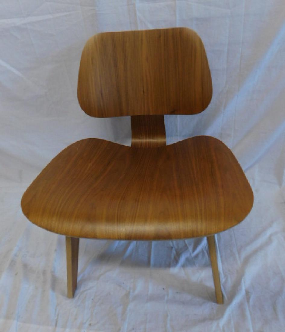 Ray & Charles Eames LCW Chair: Ray & Charles Eames LCW Chair: A molded plywood chair designed by Ray and Charles Eames, manufactured by Herman Miller. Marked with metal Eames Studio tag and HM label on underside. Manufactured in 20