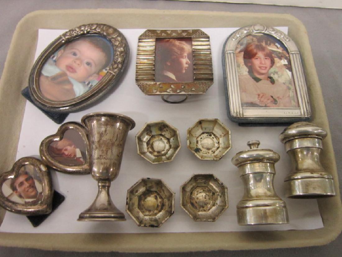 Lot Assorted Sterling Silver Pieces: Lot Assorted Sterling Silver Pieces including: four picture frames, washboard from sides with etched geometric shapes, 3 1/4" x 3 1/2", oval with raised floral embossing, 3 1/4" x 4 3/4", round top em