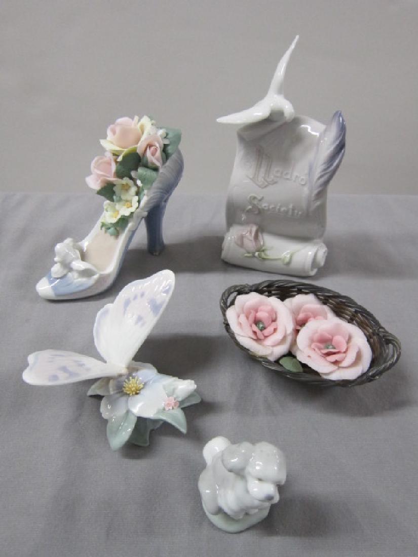 5 Assorted Lladro Porcelain Pieces: 5 Assorted Lladro Porcelain Pieces including: Lladro Society placard, scroll form with flower, feather and bird (1998 Lladro Society), 4 1/2" w x 2 1/4"h, Pink Flower basket, #1555, retired; 5 1/2"w x