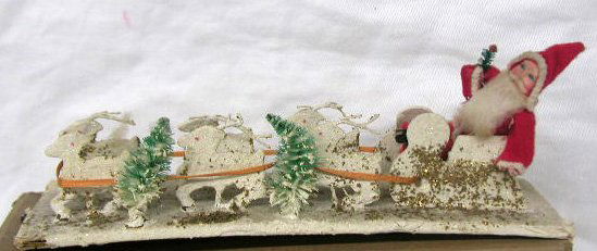 Vintage Japanese Santa Claus on sled: Vintage Japanese felt & plastic face Santa Claus on paper mache sled w/bottom portion of original box