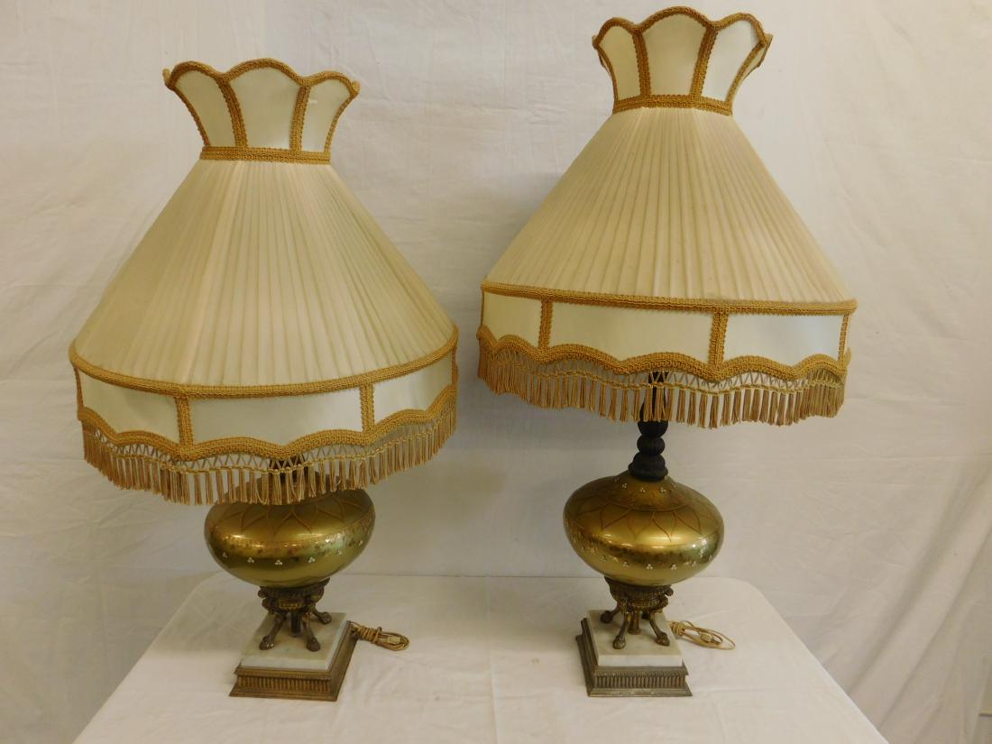 Pr Hand Painted Glass Table Lamps: Pr Hand Painted Glass Table Lamps,gold decorated floral accent, floral design, metal top shaft, metal and marble square base with metal hoof design supports, with tasseled shades. CONDITION: Needs cle
