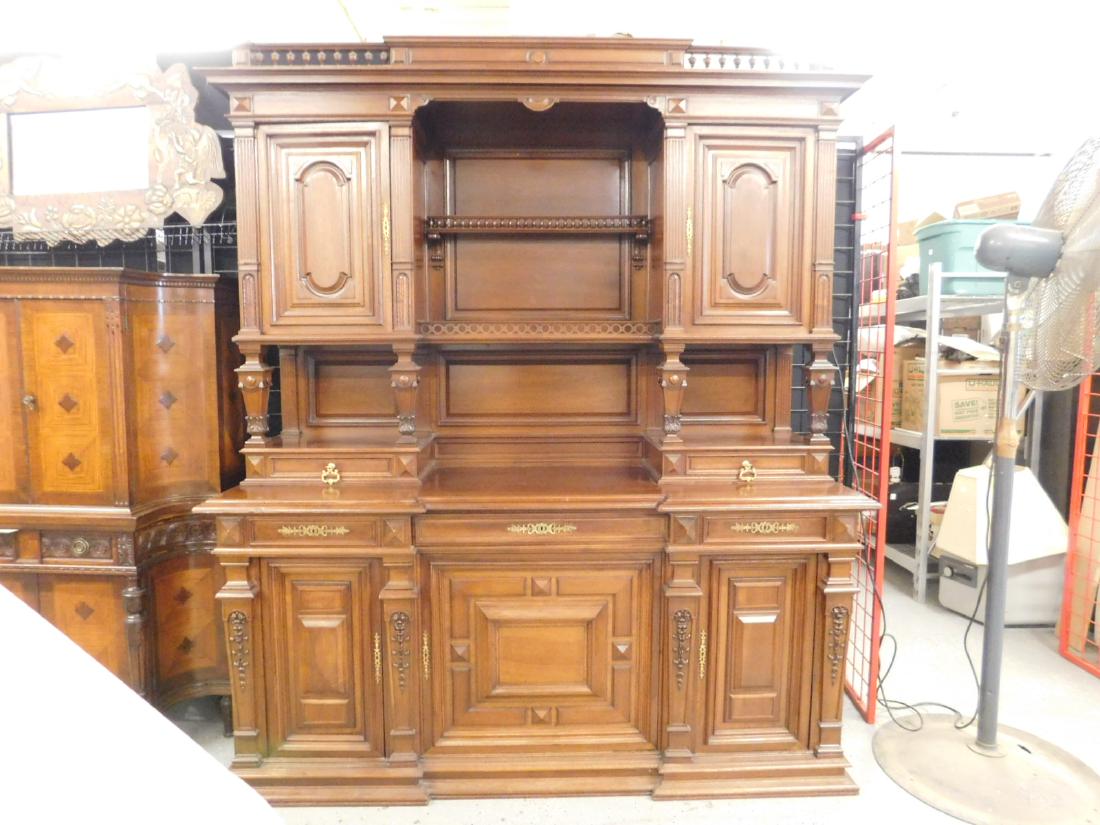 Renaissance Revival Breakfront: Renaissance Revival Breakfront, walnut, in three sections, features acanthus, baluster, ring, bell flower, reed and button carvings; heavy brass escutcheons and hardware, late 19th C, 78" x 26" x 91".