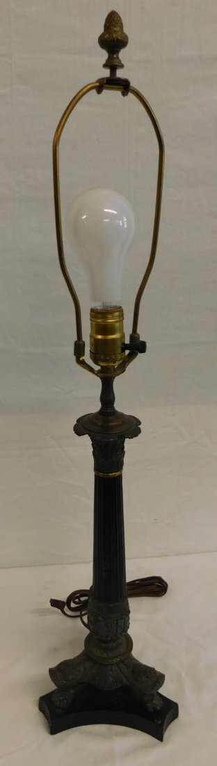 Renaissance Revival Table Lamp: Renaissance Revival Table Lamp, cast metal, ebonized reeded column with worn bronze finish top and base on tripod base with bend legs and claw feet, 20th C, electrified, column 15 1/2"h, overall 29"h 
