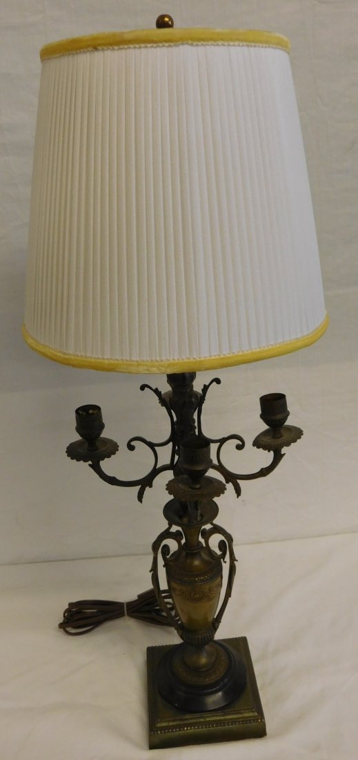 Victorian Renaissance Revival Candelabra: Victorian Renaissance Revival Candelabra, brass urn form with rosette and scroll castings and two long fancy cast side handles; four shaped arm candelabrum; circular base upon a later added square bas