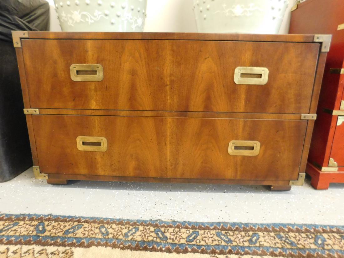 Henredon Campaign Chest: Henredon Campaign Chest, flame ground walnut, brass corner mounts and inset bale drawer and side brasses, features two long drawers, block feet, circa 1960-70, 19" x 39" x 22 1/4". CONDITION: Tarnishe