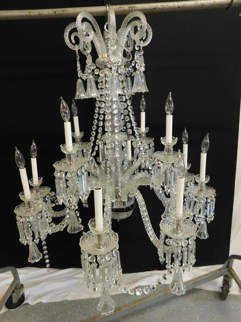 Palatial Crystal Chandelier: Palatial Crystal Chandelier, possibly Baccarat, 12 light, features Spiral pattern glass arms and scrolls, pendant crystal bells, cut spears and beads, 20th C, approx 38"h, 42"d. CONDITION: Very good, 