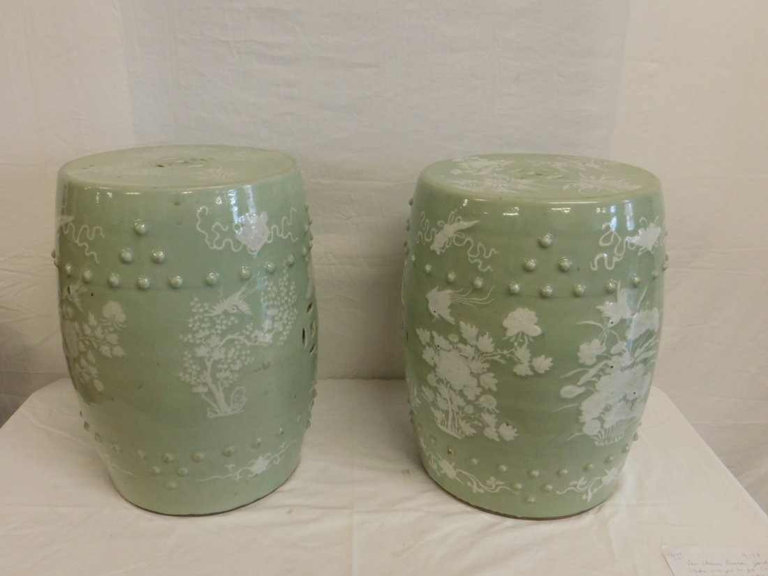 Pr Chinese Porcelain Garden Barrels: Pair Chinese Porcelain Garden Barrels, celadon with pat sur pat flowers and birds; raised faux tacks and reticulated disks, 19th / 20th C, 19"h, 13 1/2" d approx. CONDITION: Areas of manufacturing gla