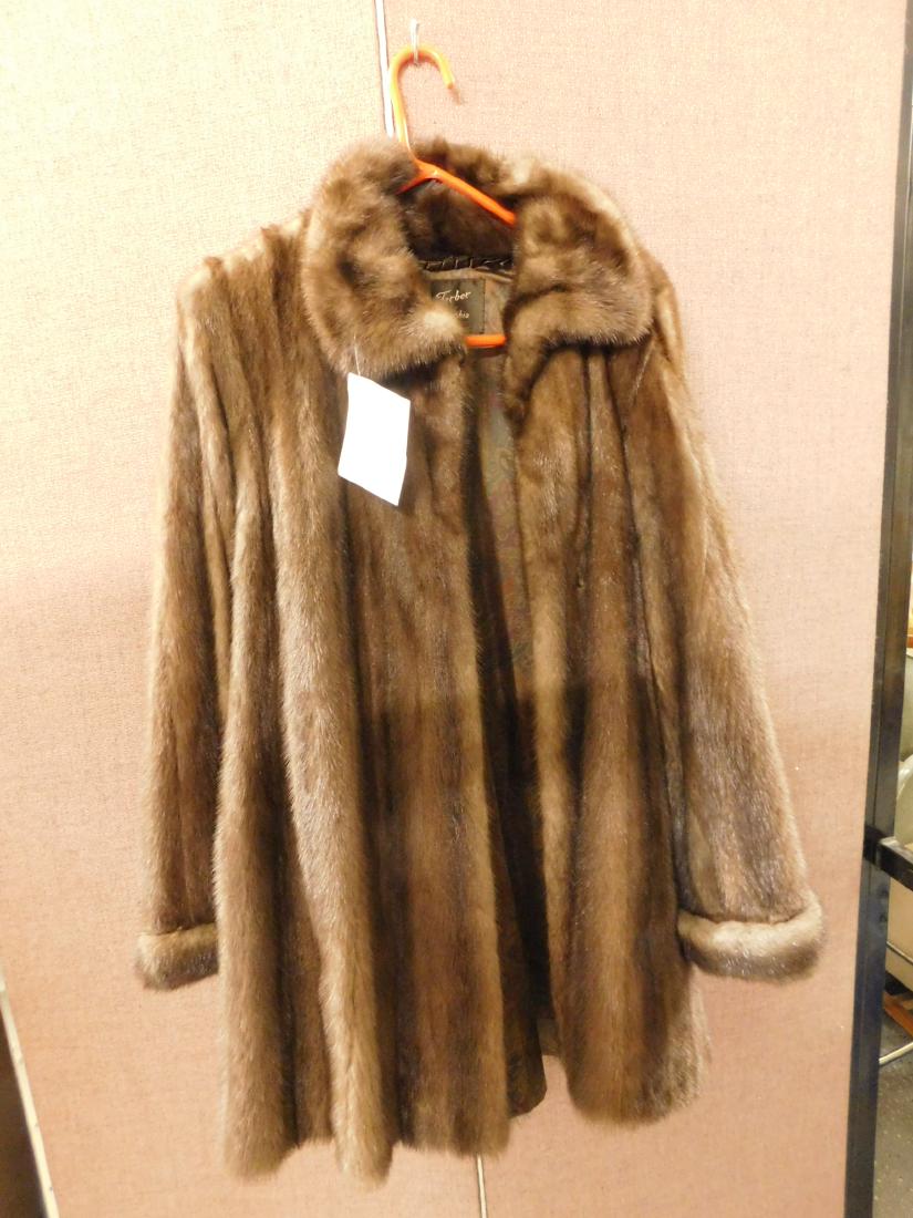 Lady's Mink Coat: Lady's Mink Coat, mahogany tone 3/4 length,standard collar, bracelet cuffs, two concealed pockets, Jacques Ferber, Phila. label, monogramed liner, shoulder to shoulder 18", 34"l, sleeve 24"l. CONDITIO